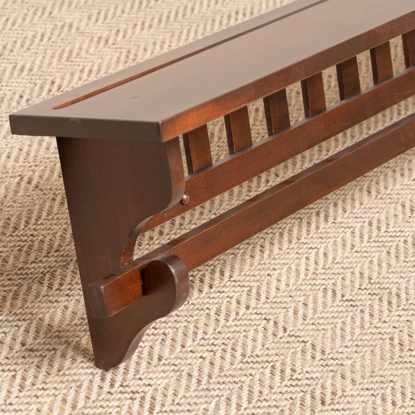 close up brown maple mission quilt rack