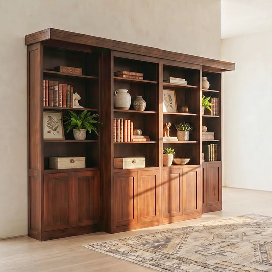 Handcrafted Briarwood bookcase Murphy bed with cabinets and shelves in a bright, elegant room.