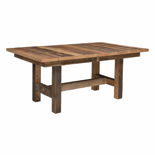 Rectangular rustic dining table with thick legs, crossbeam, and reclaimed wood construction.