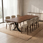 Beckett Walnut Live Edge Dining room with a wooden table and chairs in a well-lit room.