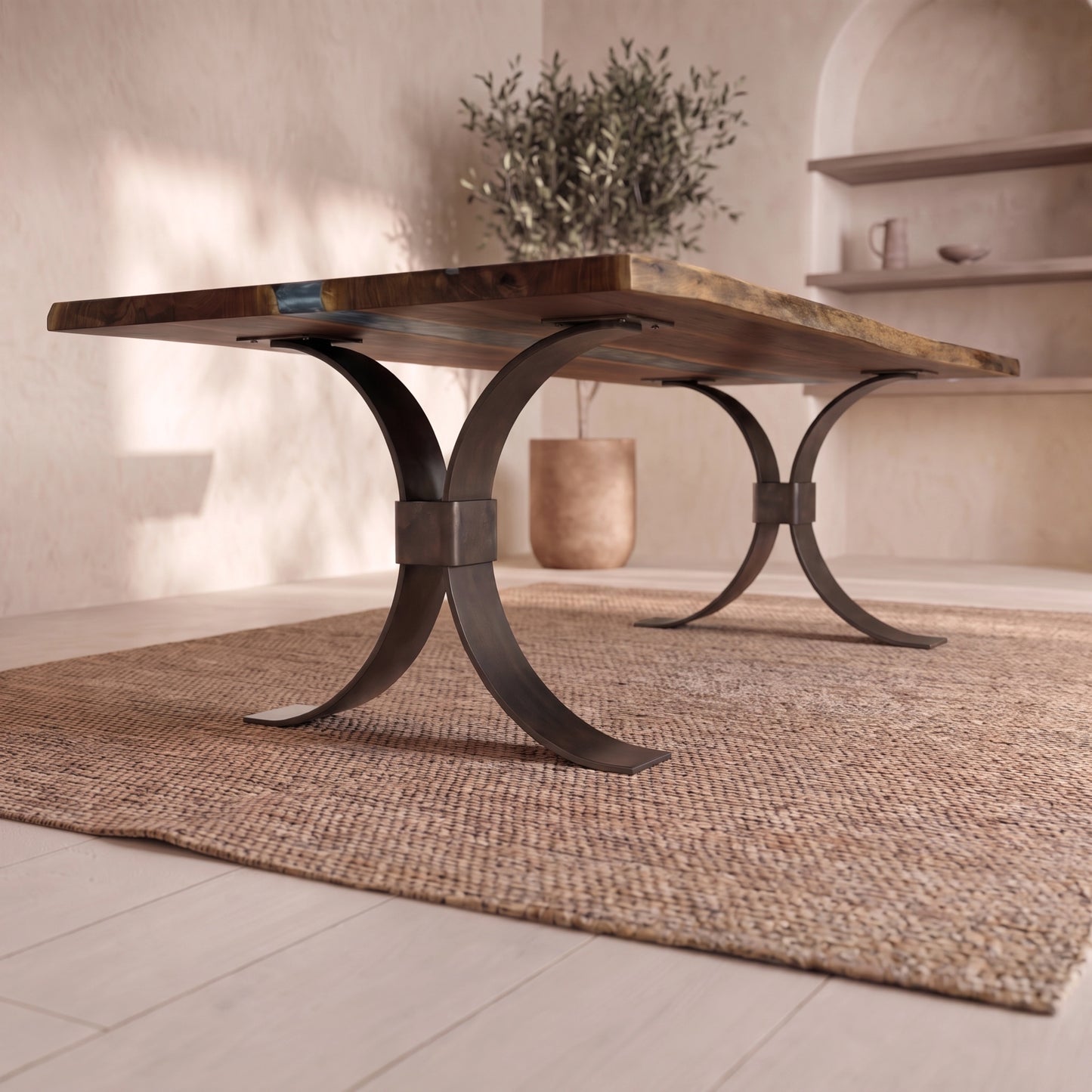 Live edge walnut table with metal legs on a woven rug in a bright room with plant and shelves.