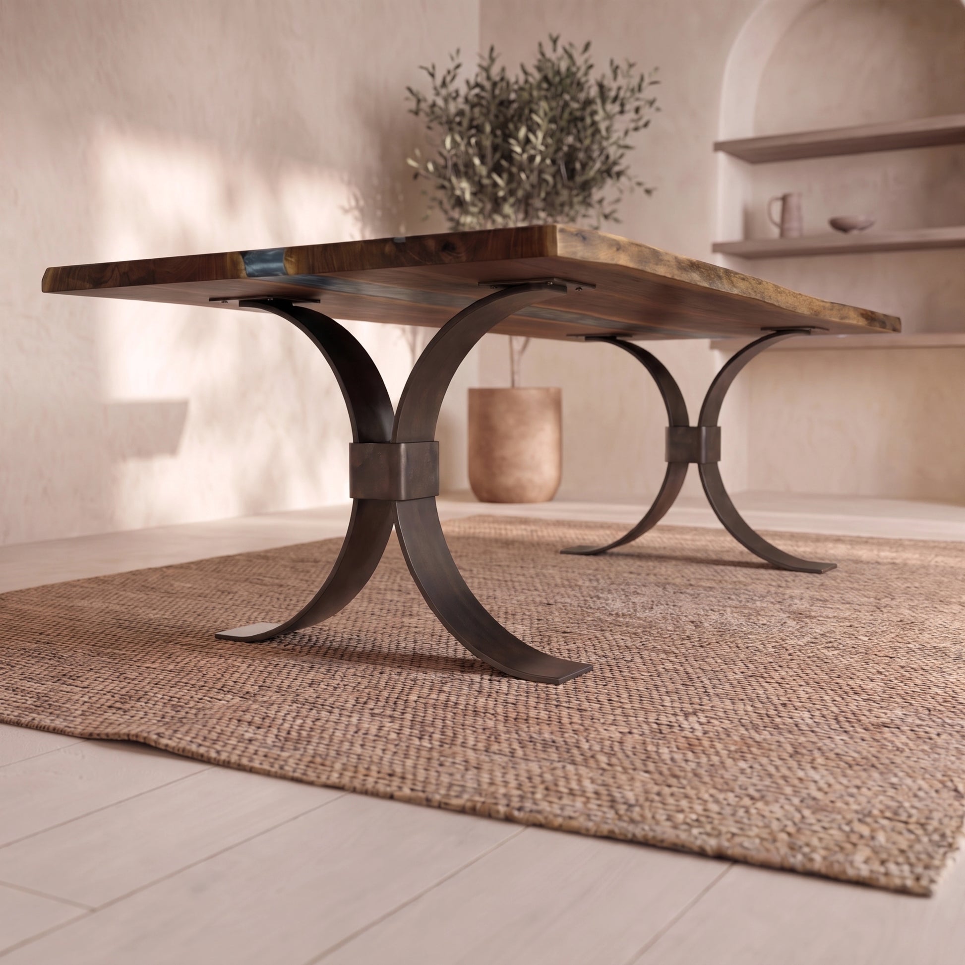 Live edge walnut table with metal legs on a woven rug in a bright room with plant and shelves.