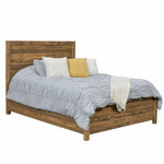 Madison wood bed with light gray ruched comforter, white/yellow pillows, and a white throw.