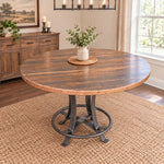 Sierra Round Barnwood counter height table with a dark metal pedestal base on a woven rug.