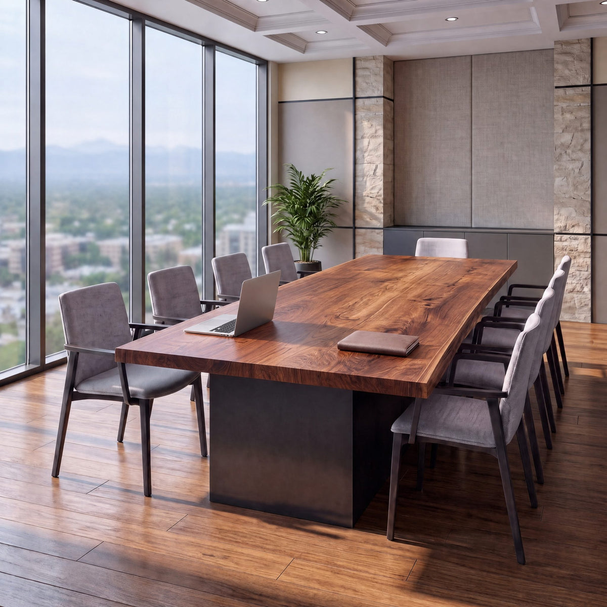 Walnut live edge conference table with steel base and gray chairs in a windowed office.