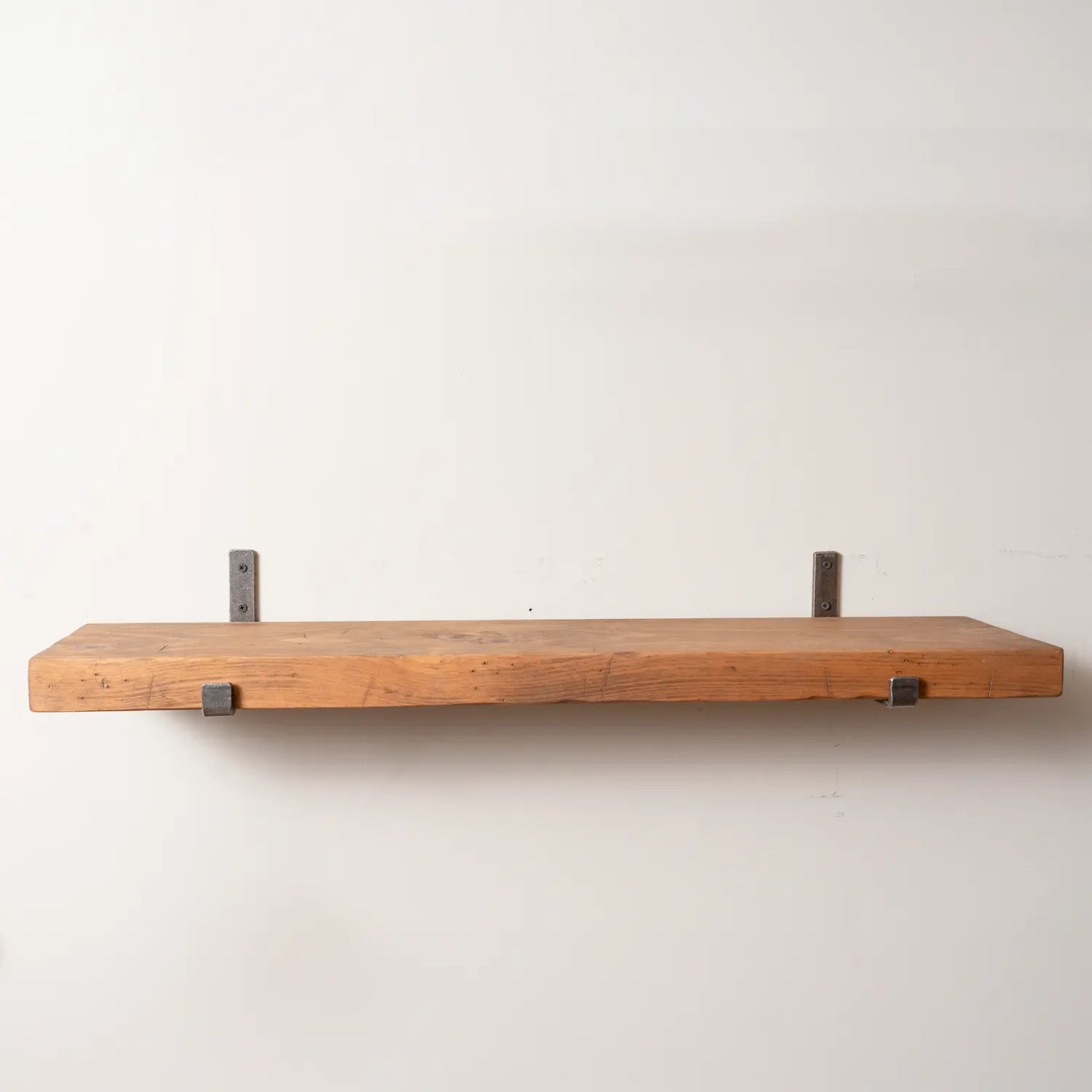 Rustic Pine Shelf with Iron Brackets