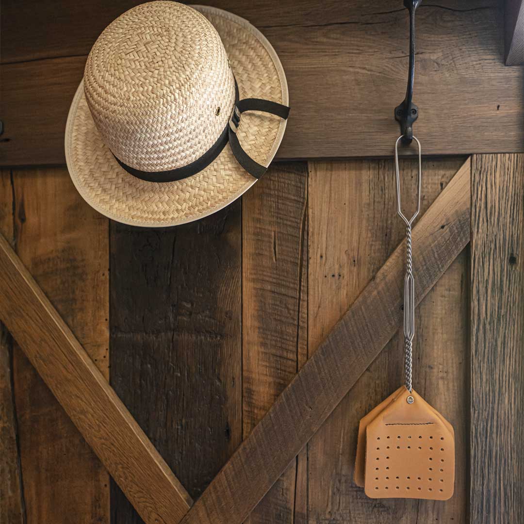 brown leather fly swatter