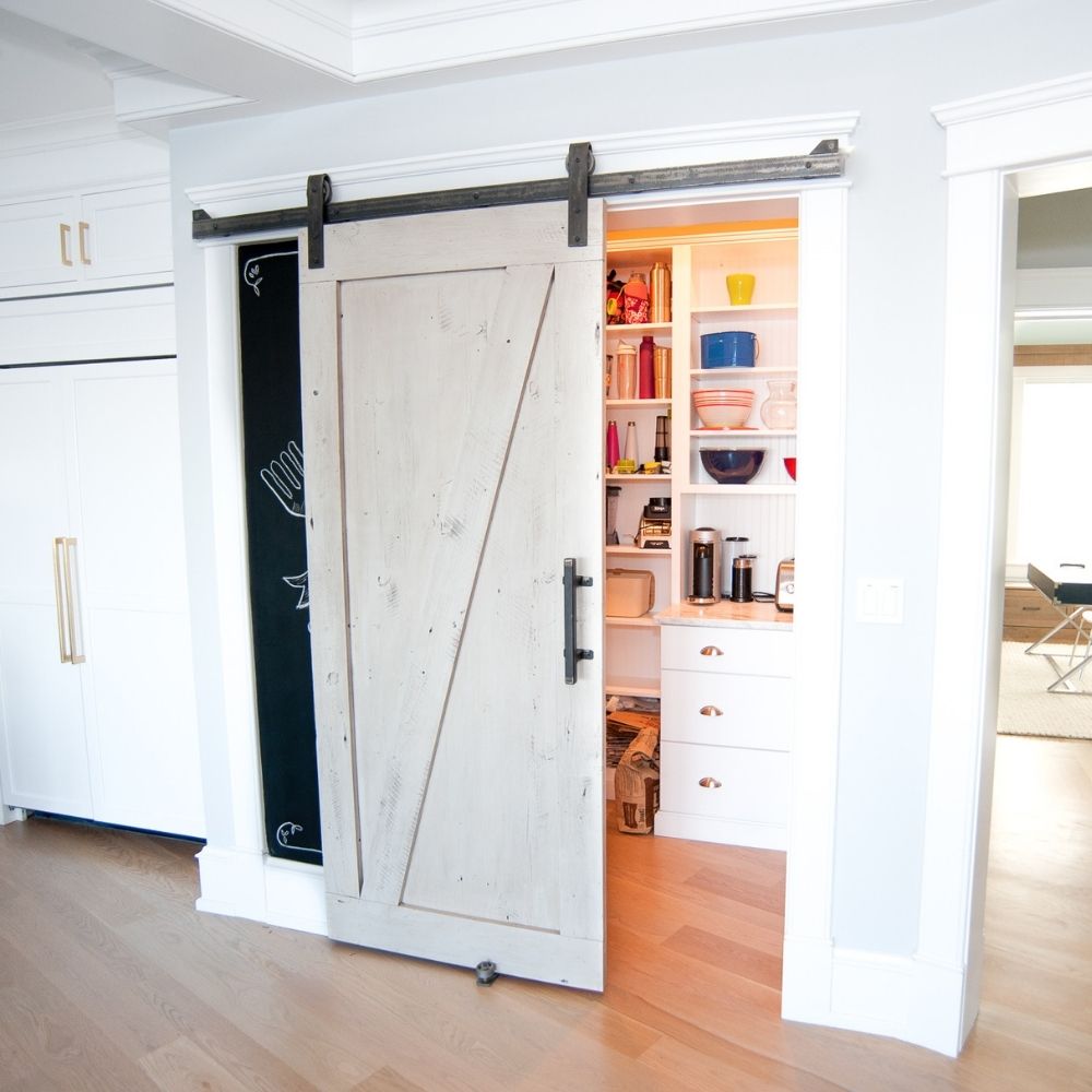 Distressed white online barn door cabinet