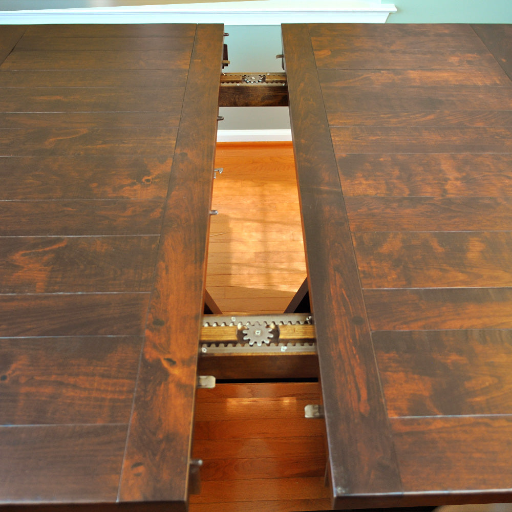 Extendable dining table mechanism in solid wood