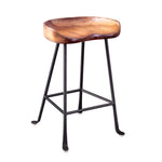Wooden tractor-style counter stool with black metal legs; minimalist and industrial design.